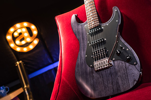 electric guitar on red chair
