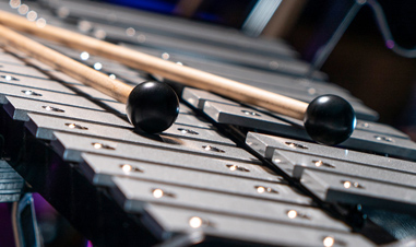sticks lying on xylophone