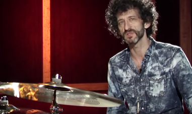 musician beside Sabian symbol