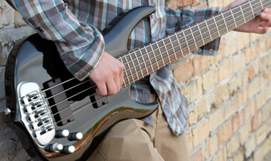 partial view of man playing Traben bass